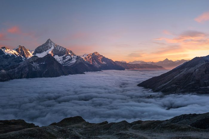 Mountain Passage, Alpine Dawn: snow peaks rising above a sea of clouds